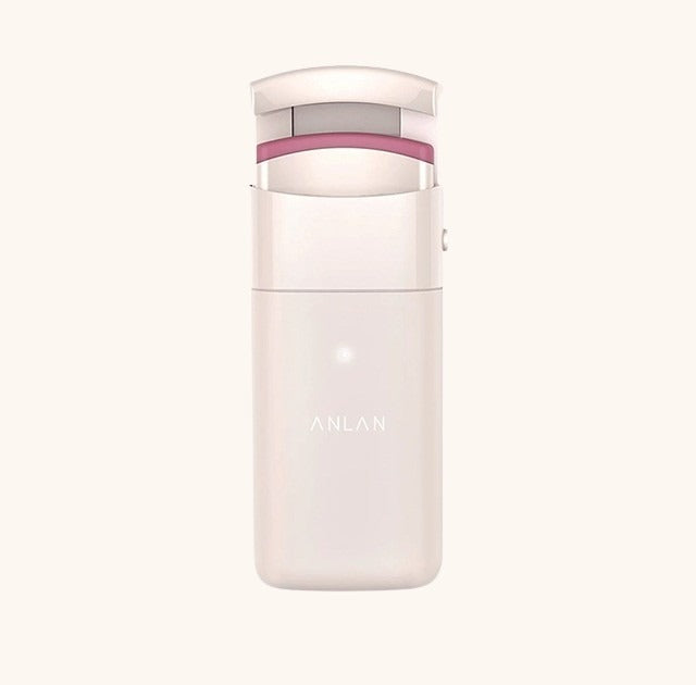 Electric eyelash curler with rechargeable heated silicone head for safe, long-lasting lash lift.