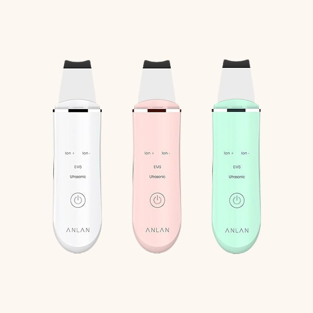 Ultrasonic Skin Scrubber in white, pink, and green for deep cleansing and skincare enhancement.